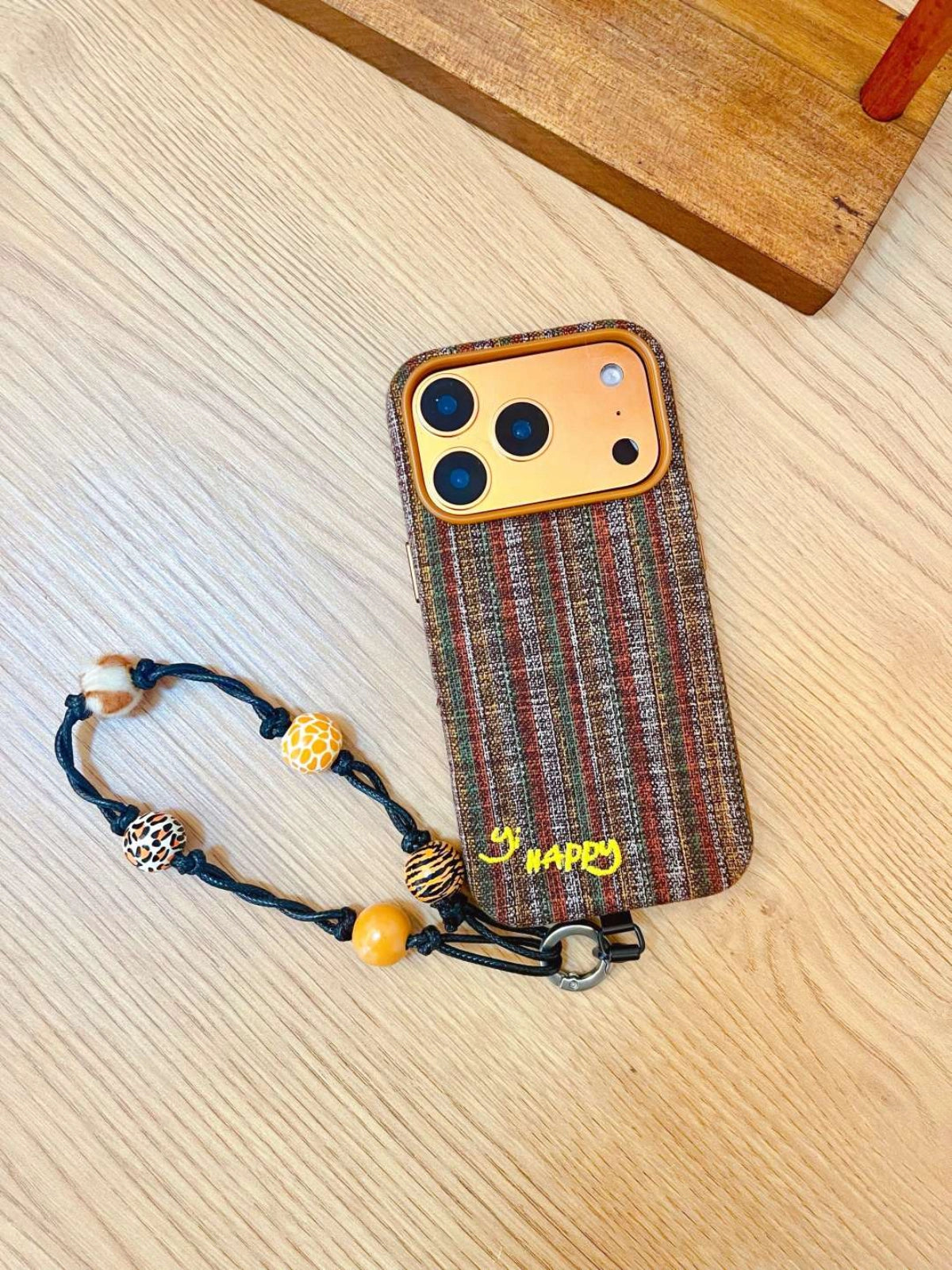 Embroidered Happy Letters phone case by TRLab Shop, featuring colorful embroidered text on a protective phone cover.
