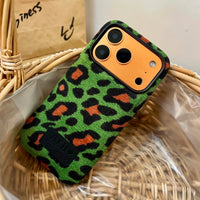 Green leopard print corduroy phone case by TRLab Shop with textured fabric and slim design for smartphones.