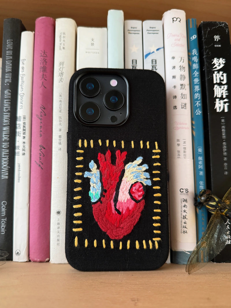 Embroidered heart design phone case by TRLab Shop with colorful floral embroidery on a protective cover.