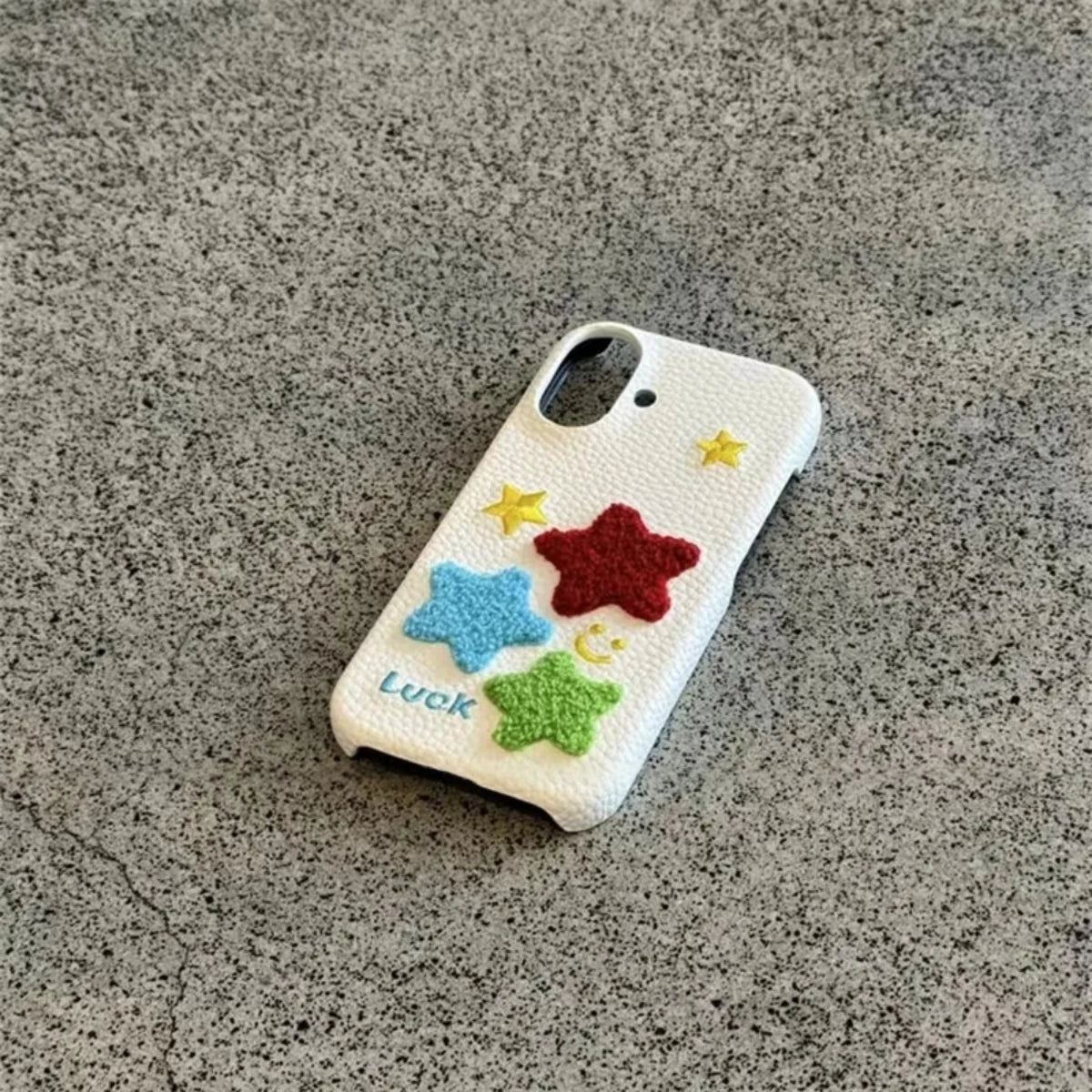 Leather Terry Star embroidered phone case by TRLab Shop, showing soft leather texture and star embroidery detail.
