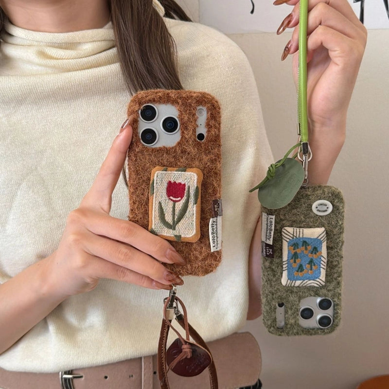 Embroidered tulip phone case by TRLab Shop with colorful floral embroidery on a protective phone cover.