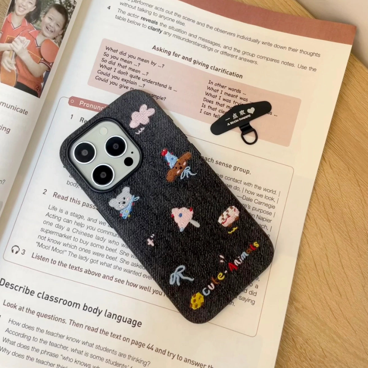 Embroidered animal phone case by TRLab Shop featuring colorful stitched animal design on durable fabric.