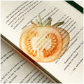 Translucent fruit-shaped acrylic bookmark with colorful fruit illustrations, ideal for marking pages in books.