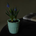 Elegant milk glass embossed vase with floral patterns, showcasing intricate details and craftsmanship.