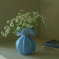 Round-bellied glass vase by TRLab Shop featuring a clear, smooth, rounded design ideal for floral arrangements.