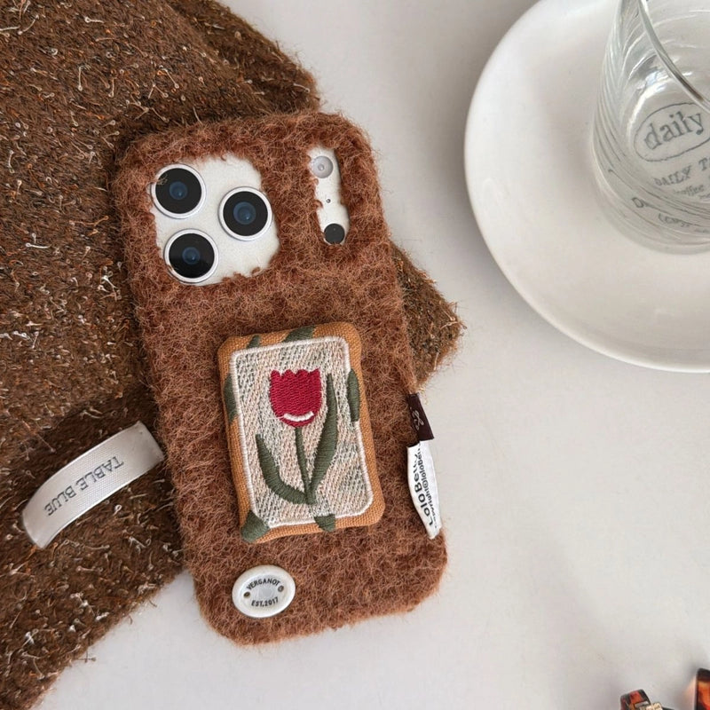 Embroidered tulip design on TRLab Shop phone case, featuring detailed floral embroidery on protective smartphone cover.