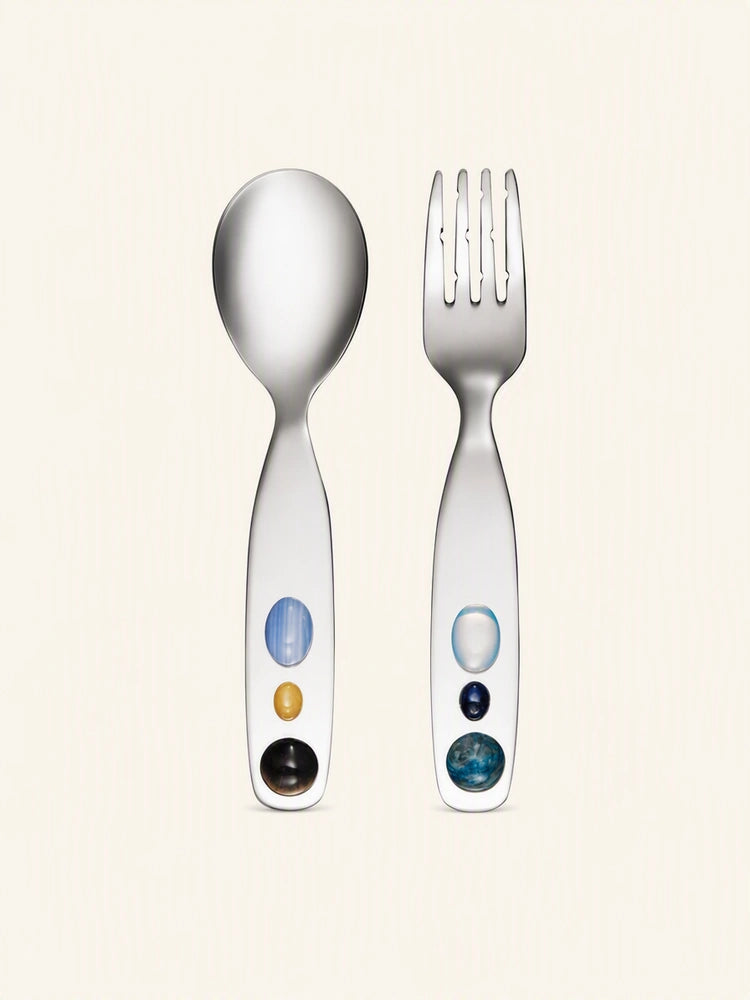 Candy Jade stainless steel spoon and fork set from SoftServe dinnerware, featuring sleek, shiny utensils on a neutral background.