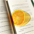 Translucent fruit-shaped acrylic bookmark with colorful fruit illustrations, ideal for marking pages in books.