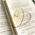 Translucent fruit-shaped acrylic bookmark with colorful fruit illustrations, ideal for marking pages in books.