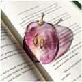 Translucent fruit-shaped acrylic bookmark with colorful fruit illustrations, ideal for marking pages in books.