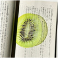 Translucent fruit-shaped acrylic bookmark with colorful fruit illustrations, ideal for marking pages in books.