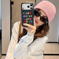 Colorful embroidered letters on a phone case by TRLab Shop, featuring vibrant, decorative embroidery design.