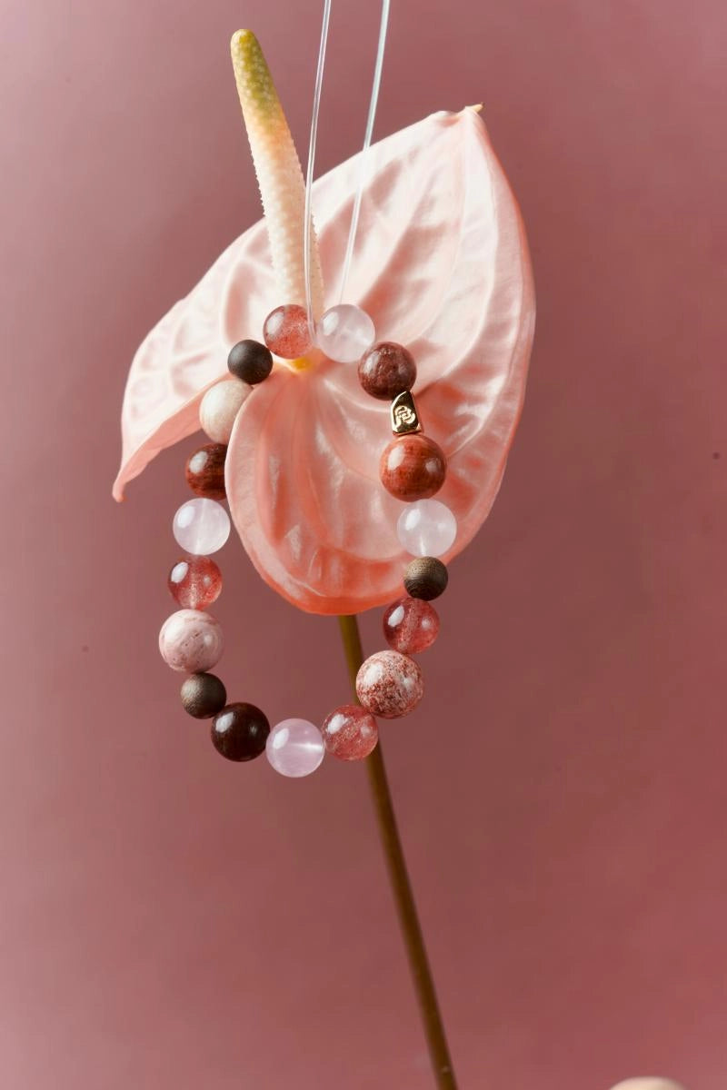 Strawberry Quartz and Red Jasper healing bracelet by ROCKBUND featuring round gemstone beads on an elastic band.