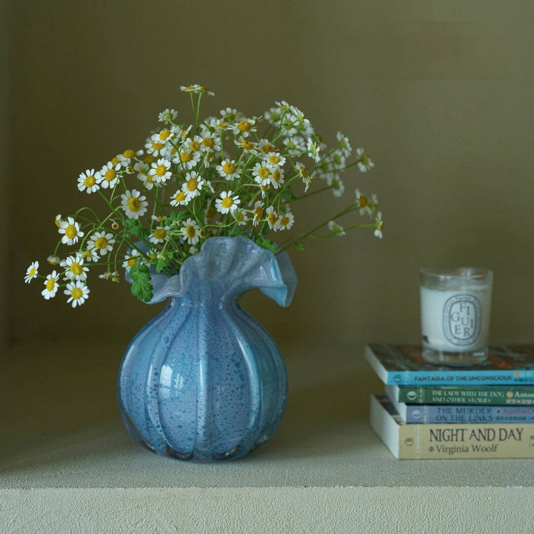 Round-bellied glass vase by TRLab Shop with clear, smooth surface and wide opening, perfect for floral arrangements.