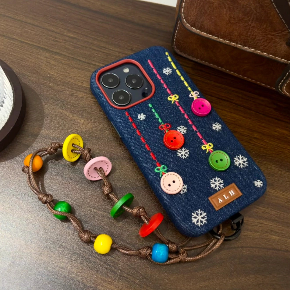 TRLab Shop embroidered phone case with buttons and snowflake design, featuring detailed snowflake embroidery on a protective case.