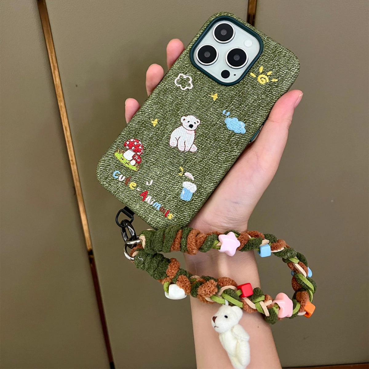 White bear embroidered phone case by TRLab Shop featuring detailed bear embroidery on a sleek white protective cover.