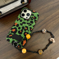 Green leopard print corduroy phone case by TRLab Shop, showing textured fabric and stylish design for smartphones.