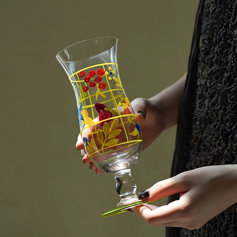 Hand-painted glass vase with intricate floral designs, showcasing vibrant colors and artistic craftsmanship.