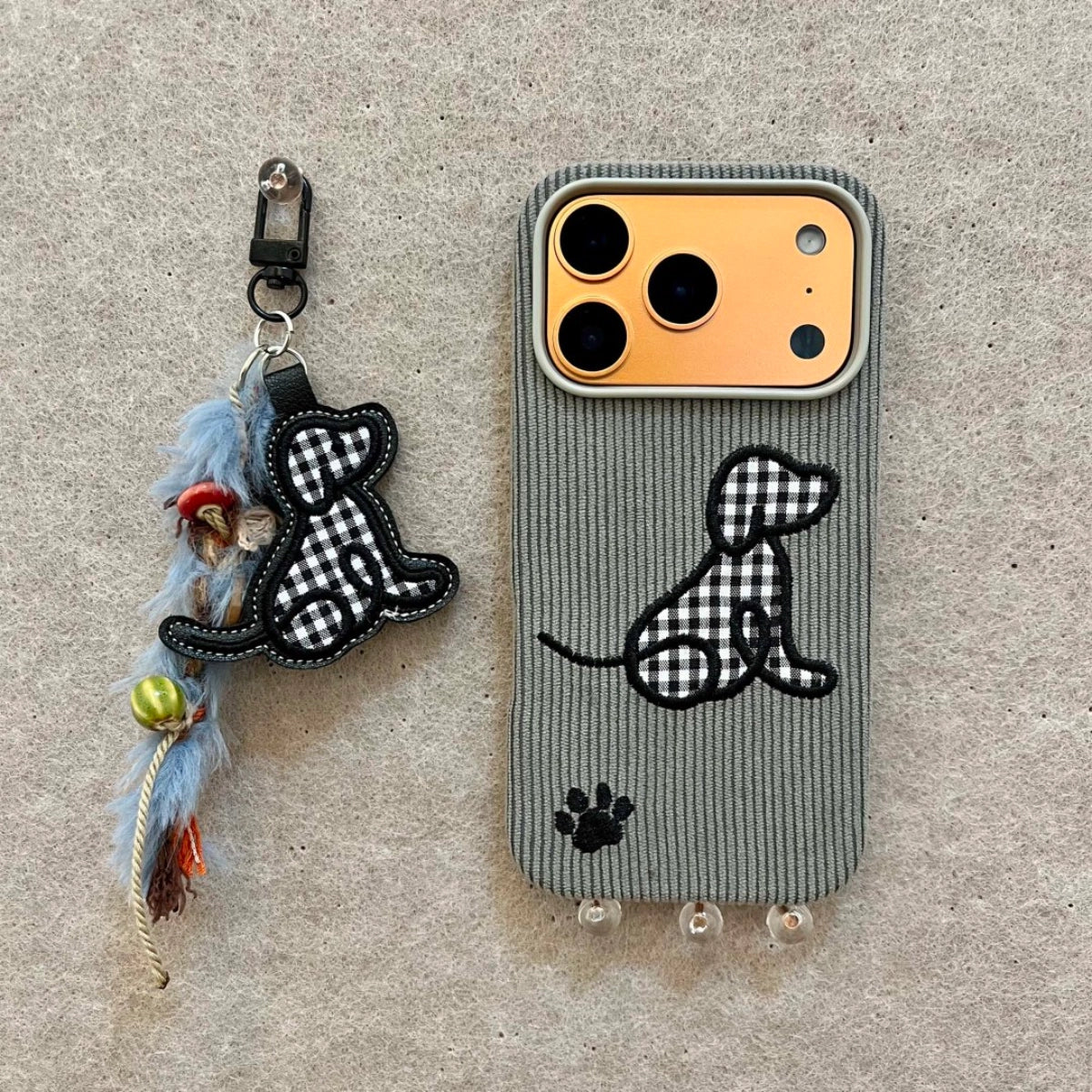 Plaid puppy embroidered phone case by TRLab Shop featuring a cute puppy design on a colorful plaid background.