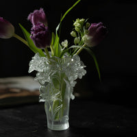 Elegant floral glass vase by TRLab Shop with a clear, curved design suitable for fresh or artificial flowers.
