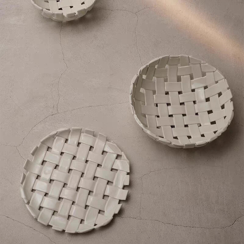 Woven ceramic plate by TRLab Shop, showcasing a detailed, handcrafted design with a smooth, glazed surface and intricate weaving pattern.