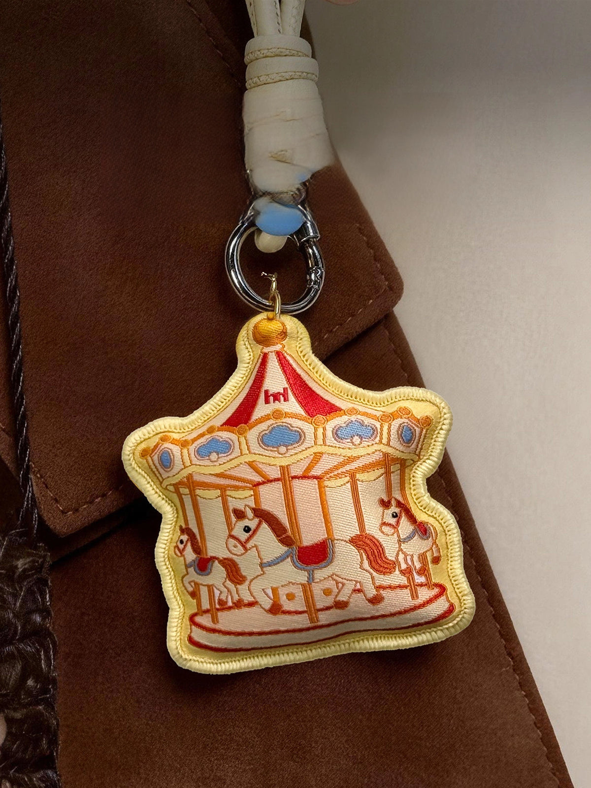 TRLab Shop Carousel Sachet Bag Charm featuring a colorful, decorative carousel design, perfect as a stylish accessory for bags.