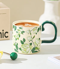 French-Style Camellia ceramic mug by TRLab Shop featuring a white mug with a delicate camellia flower design.