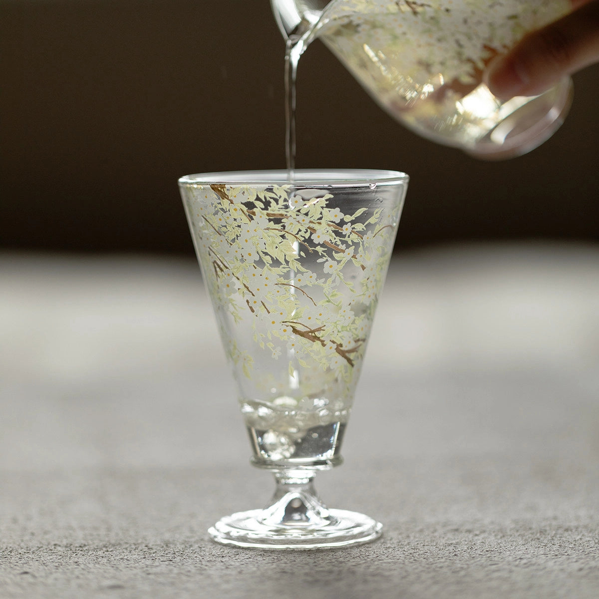 Elegant Pear-Blossom Glass Goblet by TRLab Shop, showcasing a clear, decorative wine glass with a floral design.