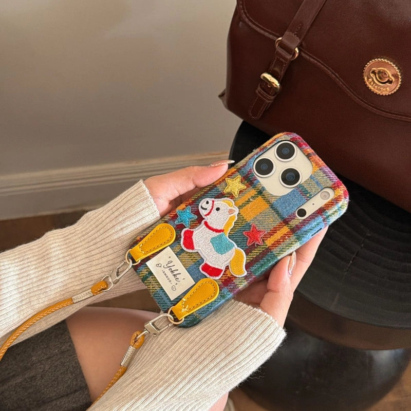 Plaid Pony embroidered phone case by TRLab Shop featuring a colorful plaid pattern and a stitched pony embroidery design.