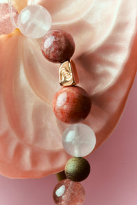 Strawberry Quartz and Red Jasper healing bracelet featuring polished beads, designed by ROCKBUND for wellness and style.
