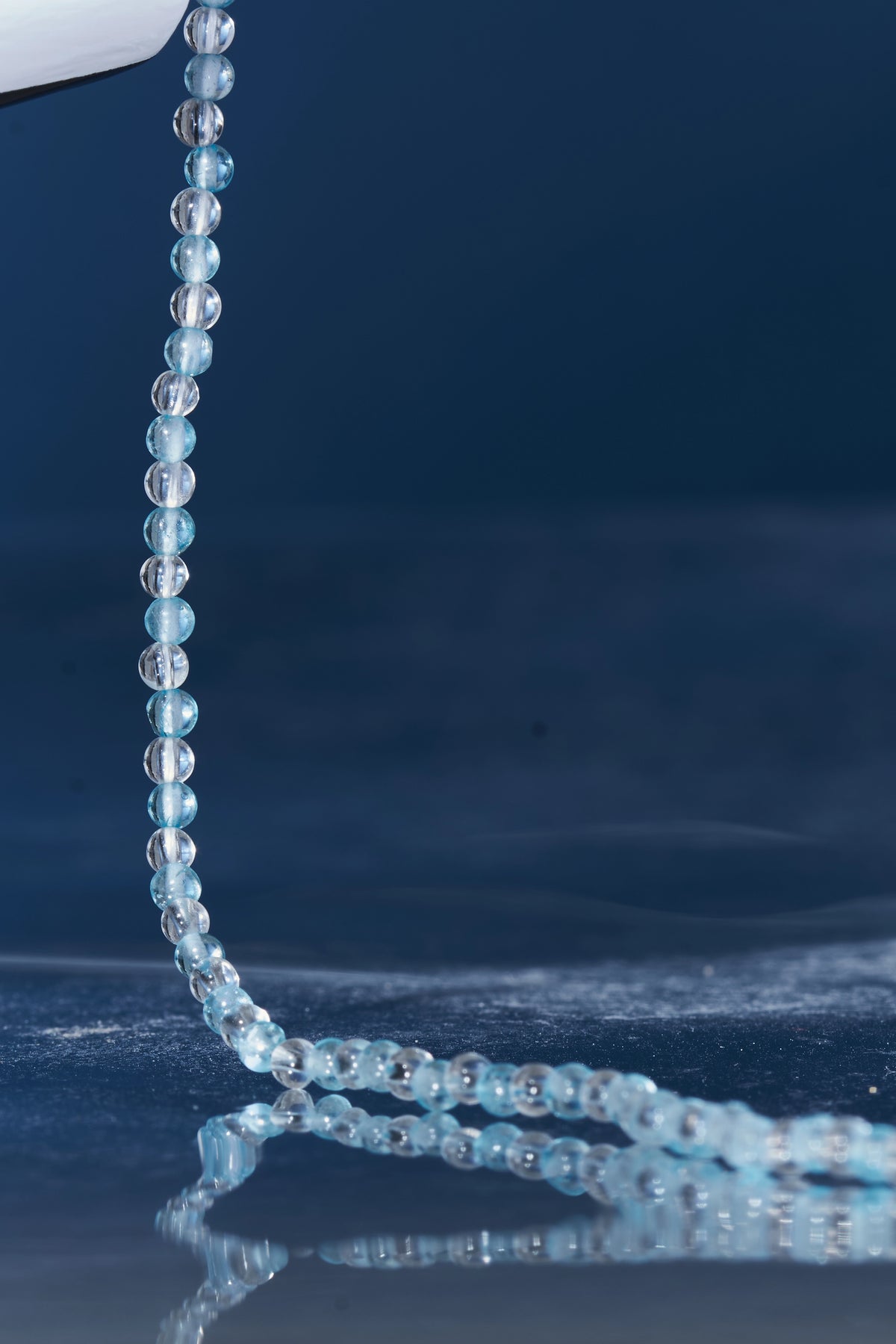 ROCKBUND aquamarine and clear quartz eyeglass chain with beaded design, featuring vibrant blue and transparent stones.