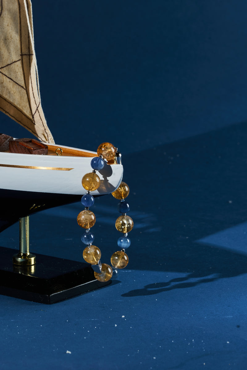 Citrine and kyanite healing bracelet with polished beads from ROCKBUND, featuring warm yellow and blue stones on an elastic band.