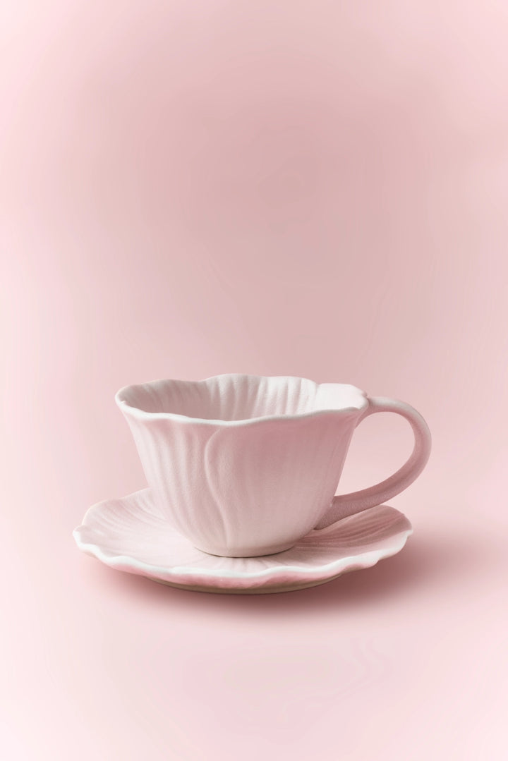 Floral ceramic cup and saucer set from TRLab Shop with colorful flower patterns, perfect for tea or coffee serving.