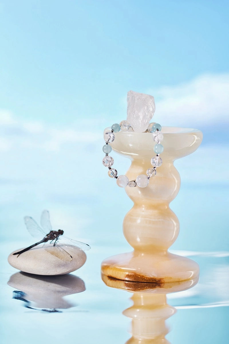 ROCKBUND Yun Ze “Ethereal Mist” crystal healing bracelet featuring light blue and clear beads on an elastic band.