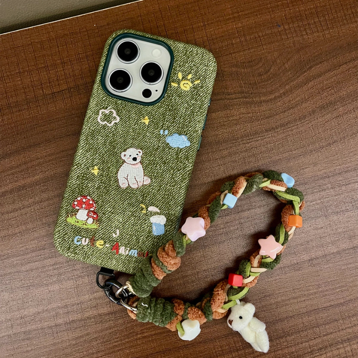 White bear embroidered phone case from TRLab Shop, featuring soft fabric with a cute bear design for iPhone or Android.