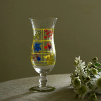 Hand-painted glass vase with floral design, featuring vibrant colors and a curved shape, ideal for decorative display.