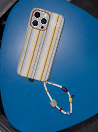 Striped fabric phone case by TRLab Shop with colorful horizontal stripes and soft textile material.