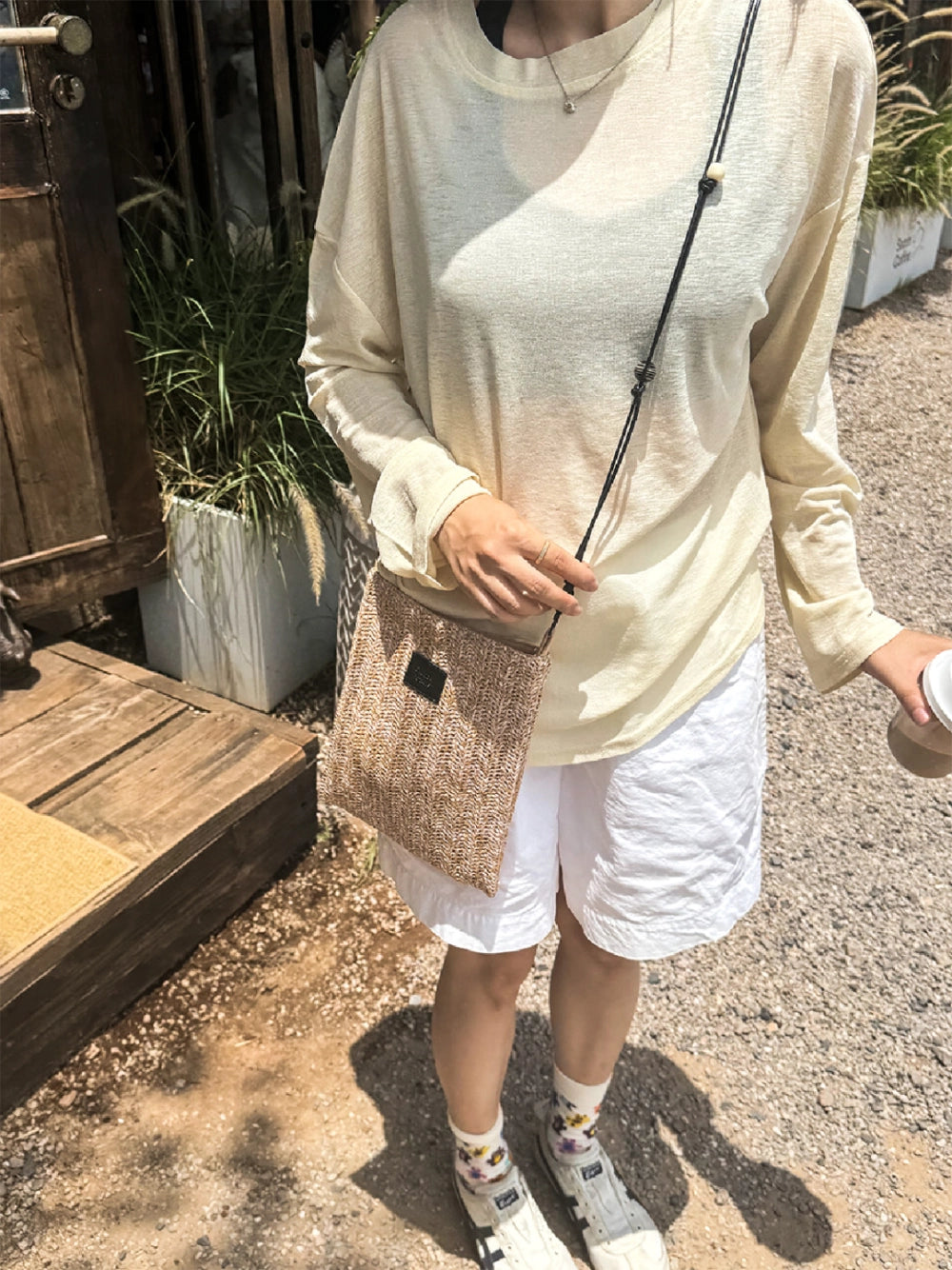 Beaded straw crossbody bag by TRLab Shop featuring colorful bead details and a woven straw strap.