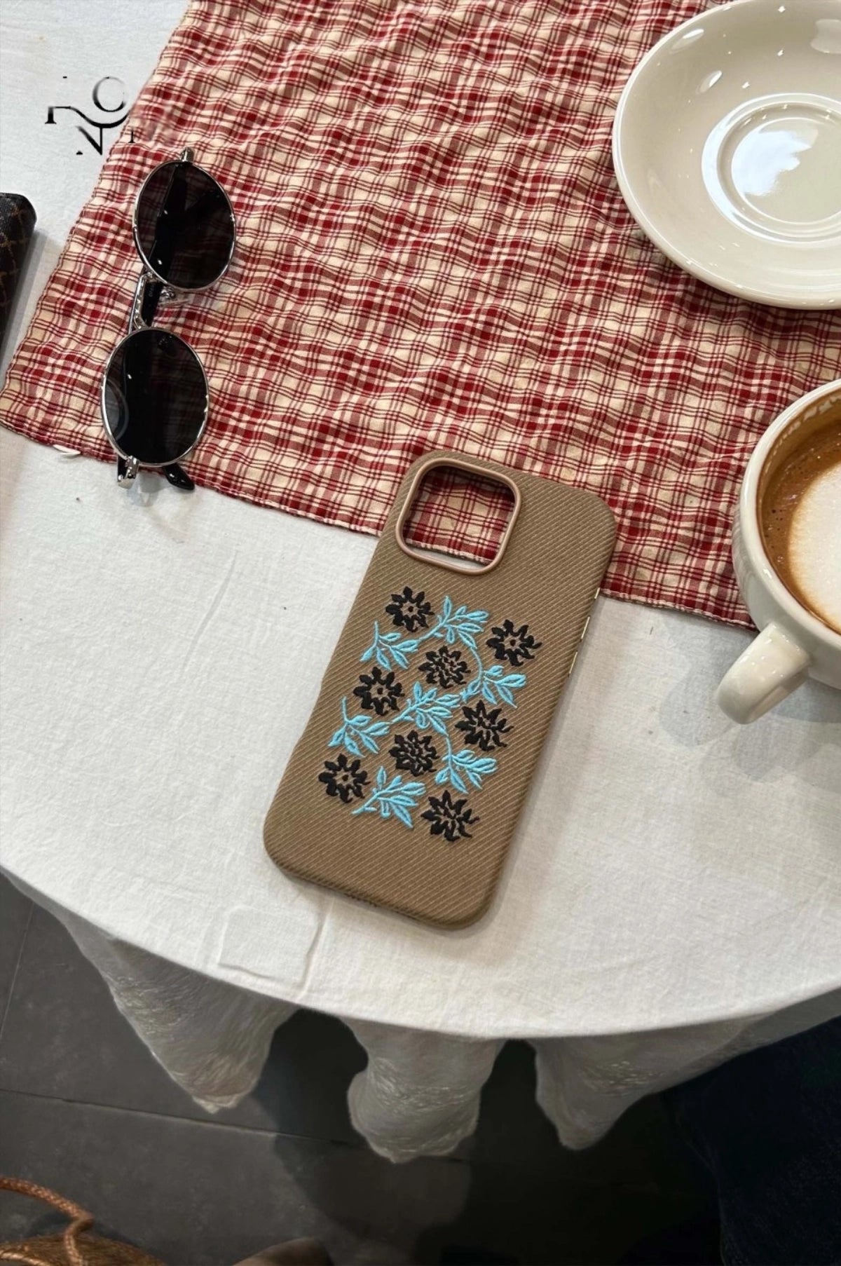 Vine and floral embroidered phone case by TRLab Shop, featuring colorful floral and vine designs on a protective smartphone cover.