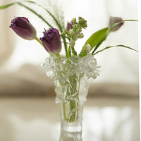 Clear floral glass vase with a rounded shape, featuring a floral pattern and smooth finish, ideal for decorative flower arrangements.