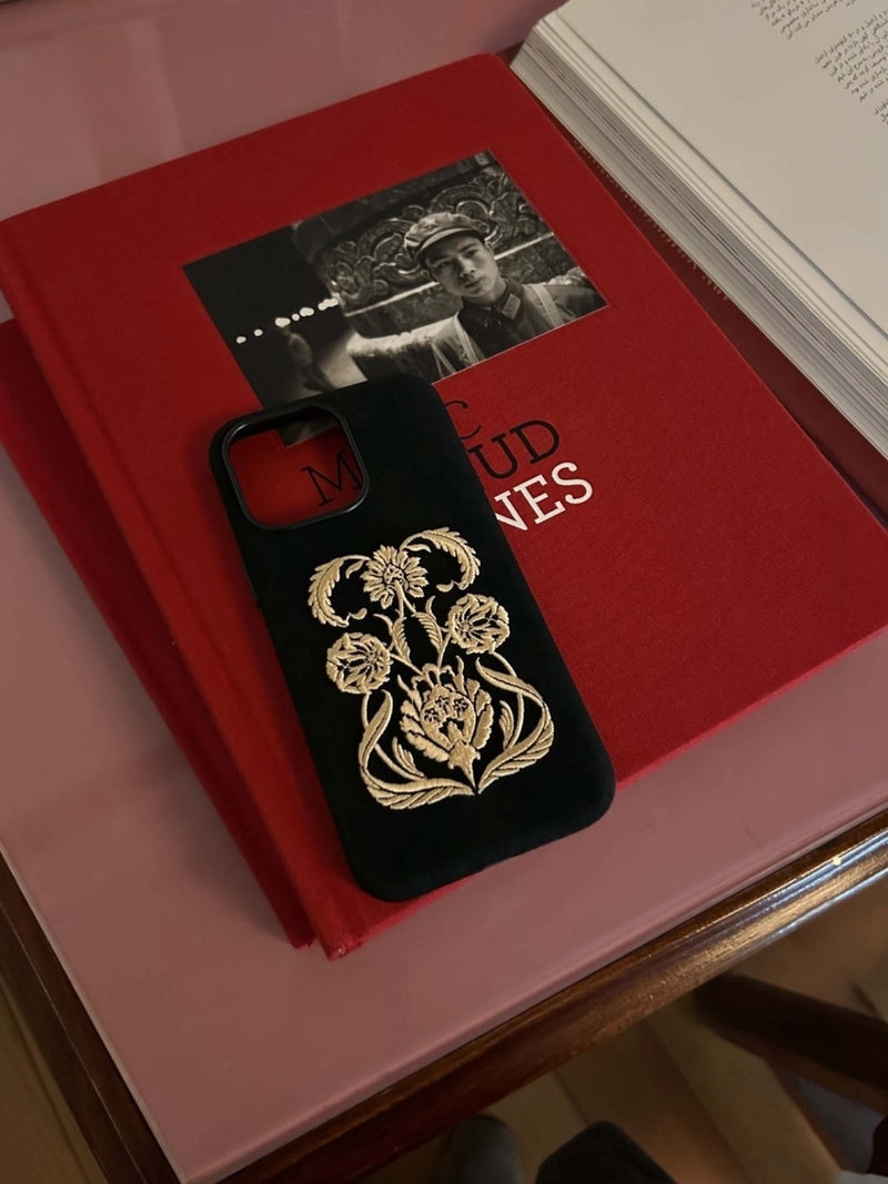 Black Shamanic embroidered phone case with intricate tribal designs, made by TRLab Shop, featuring detailed stitching on durable material.