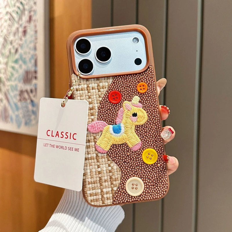 Tweed plaid embroidered unicorn phone case by TRLab Shop, featuring colorful unicorn design and textured fabric for iPhone protection.