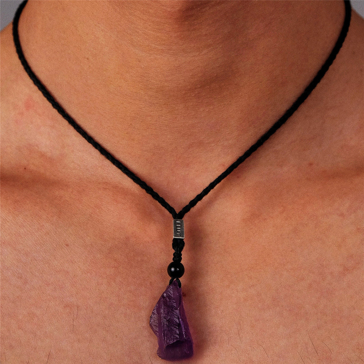 Brazilian Amethyst necklace with polished purple gemstone beads and silver clasp, showcasing a elegant jewelry design.