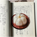 Translucent fruit-shaped acrylic bookmark with colorful fruit illustrations, ideal for marking pages in books.