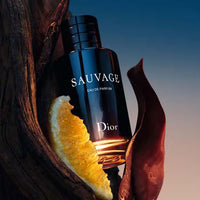 Christian Dior Sauvage men's perfume bottle with sleek design and dark blue accents, showcasing the iconic fragrance.