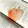 Translucent fruit-shaped acrylic bookmark with colorful fruit illustrations, ideal for marking pages in books.
