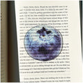 Translucent fruit-shaped acrylic bookmark with colorful fruit illustrations, ideal for marking pages in books.