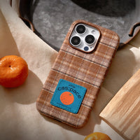 Brown plaid fabric phone case with TRLab Shop branding, featuring a soft, stylish design for a secure fit and protection.