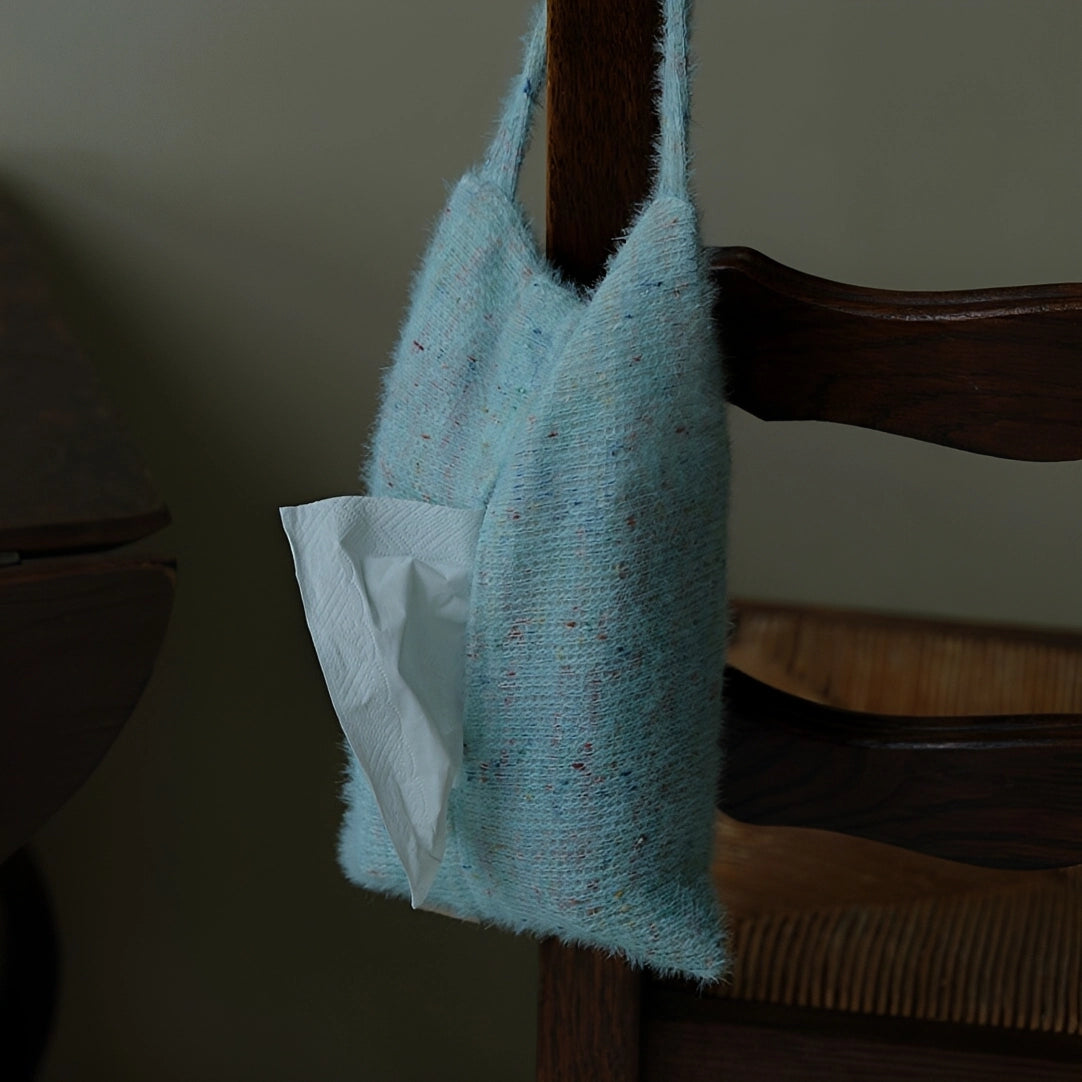 Knitted-handle tissue pack with soft tissues, featuring a cozy knitted handle for easy carrying and stylish storage.