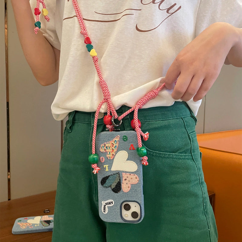 Love Heart embroidered phone case by TRLab Shop featuring pink fabric with heart embroidery and slim protective design.